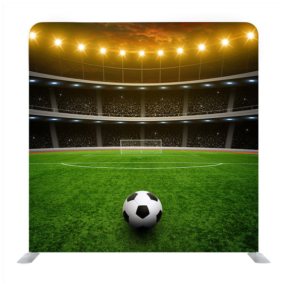 Soccer Ball On Green Stadium, Arena In Night Illuminated Yellow Bright Spotlights Background Media Wall - Backdropsource