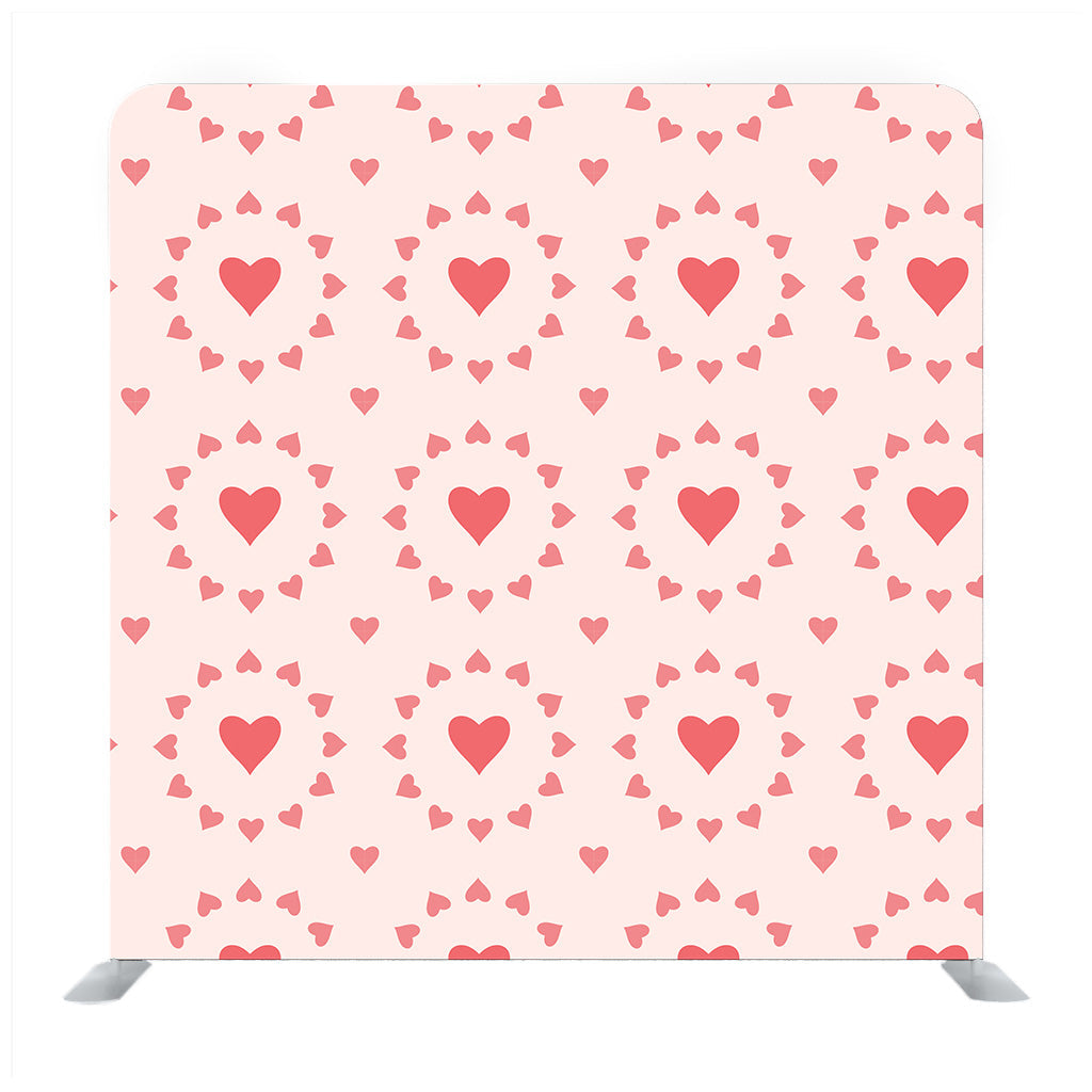 Tiny red hearts pattern with orange background Media wall - Backdropsource