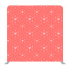 White polka heart pattern on pastel orange Background Media wall - Backdropsource